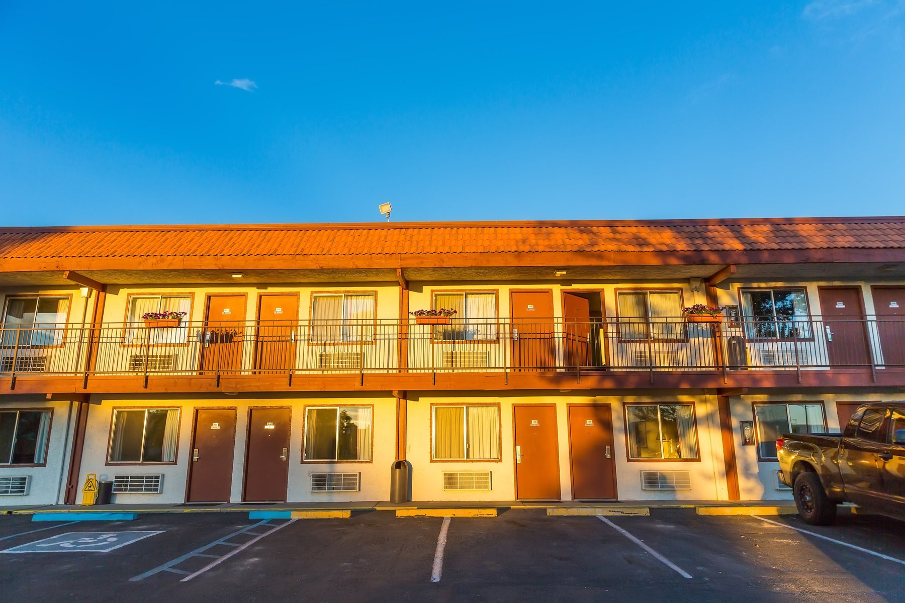 A two storey American roadside hotel on a clear day